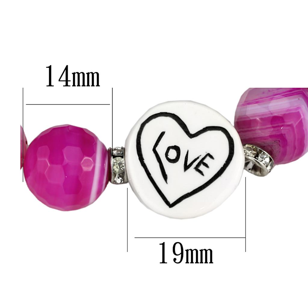 Antique silver brass bracelet featuring a vibrant fuchsia synthetic onyx stone, showcasing intricate craftsmanship and elegant design.