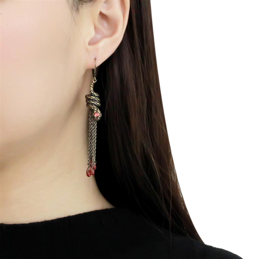 Antique Copper Brass Earrings featuring AAA Grade CZ in Garnet, showcasing a vintage design with a rich red stone.