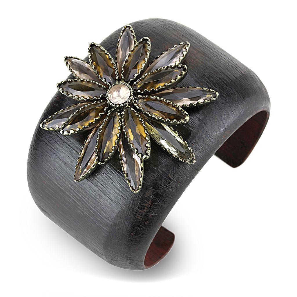 Antique copper brass bangle featuring a champagne synthetic stone centerpiece, showcasing intricate craftsmanship and elegant design.