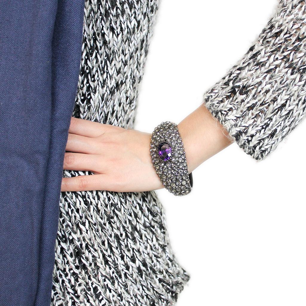 LO4275 TIN Cobalt Black Brass Bangle featuring AAA Grade CZ in Tanzanite, showcasing its elegant design and vibrant color.