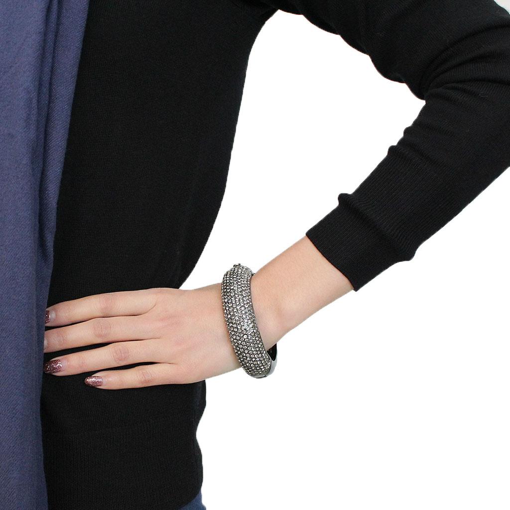 LO4304 TIN Cobalt Black Brass Bangle featuring a Top Grade Crystal center stone in Black Diamond color, elegantly designed for modern fashion.