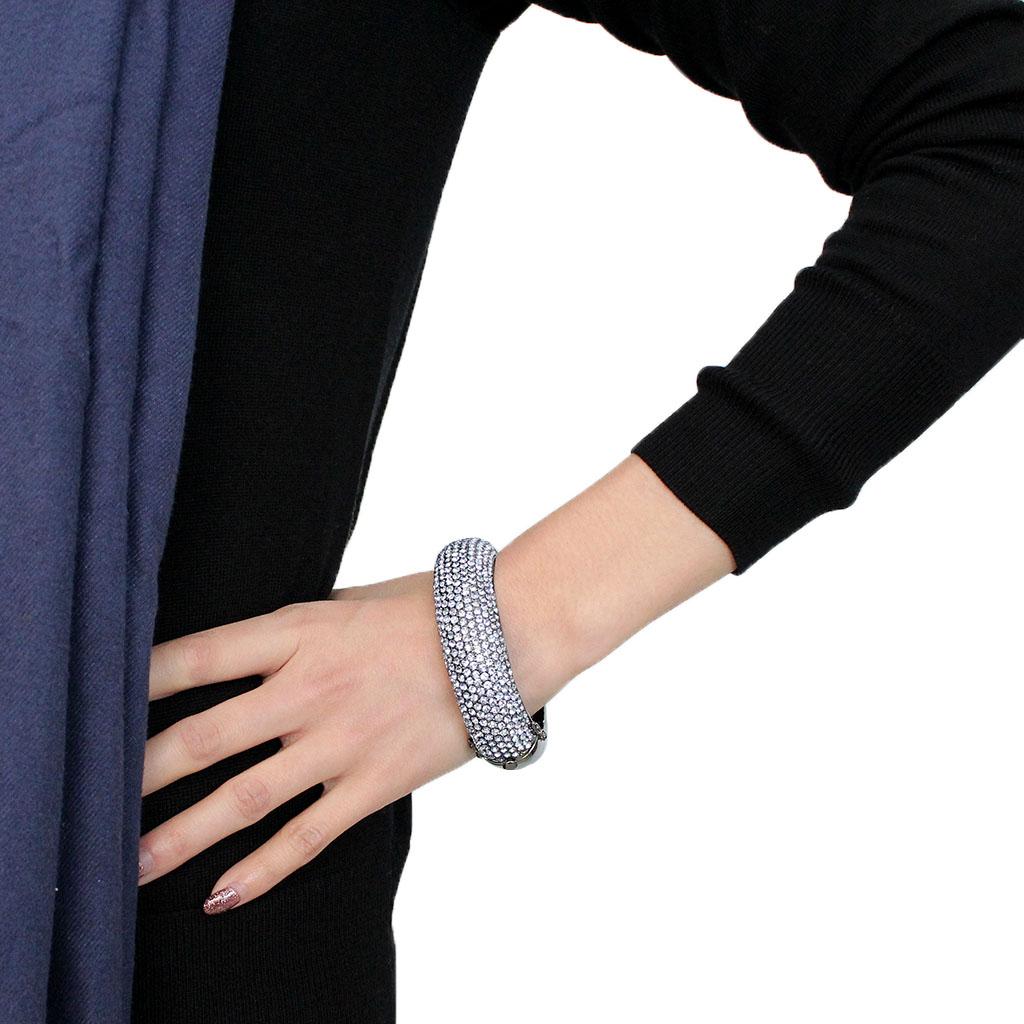 LO4307 TIN Cobalt Black Brass Bangle featuring an aquamarine top grade crystal, showcasing a modern and elegant design.
