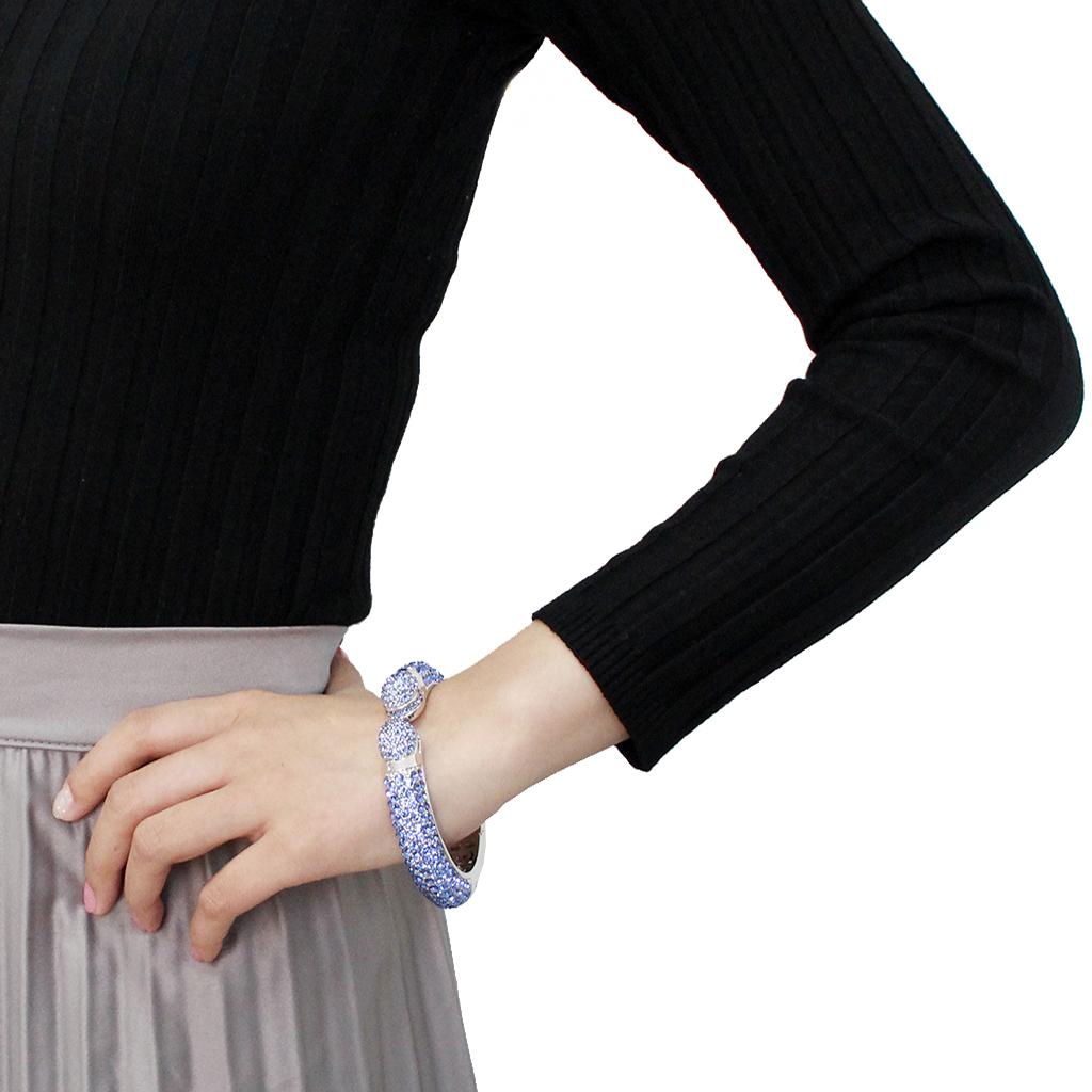 LO4315 Rhodium Brass Bangle featuring light sapphire crystals, showcasing its elegant design and luxurious finish.