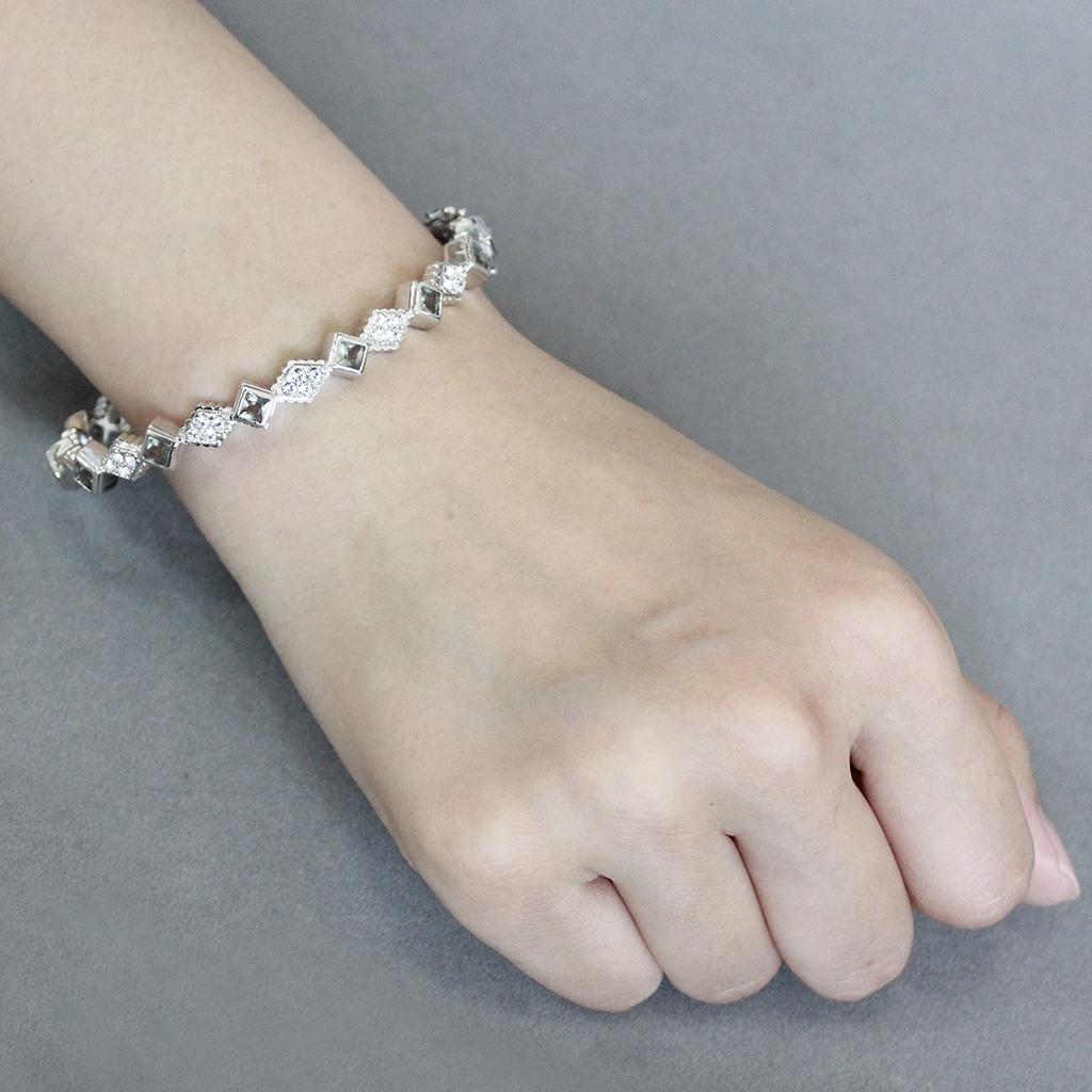 LO4340 Rhodium Brass Bangle featuring a gray synthetic stone, showcasing its elegant design and luxurious finish.