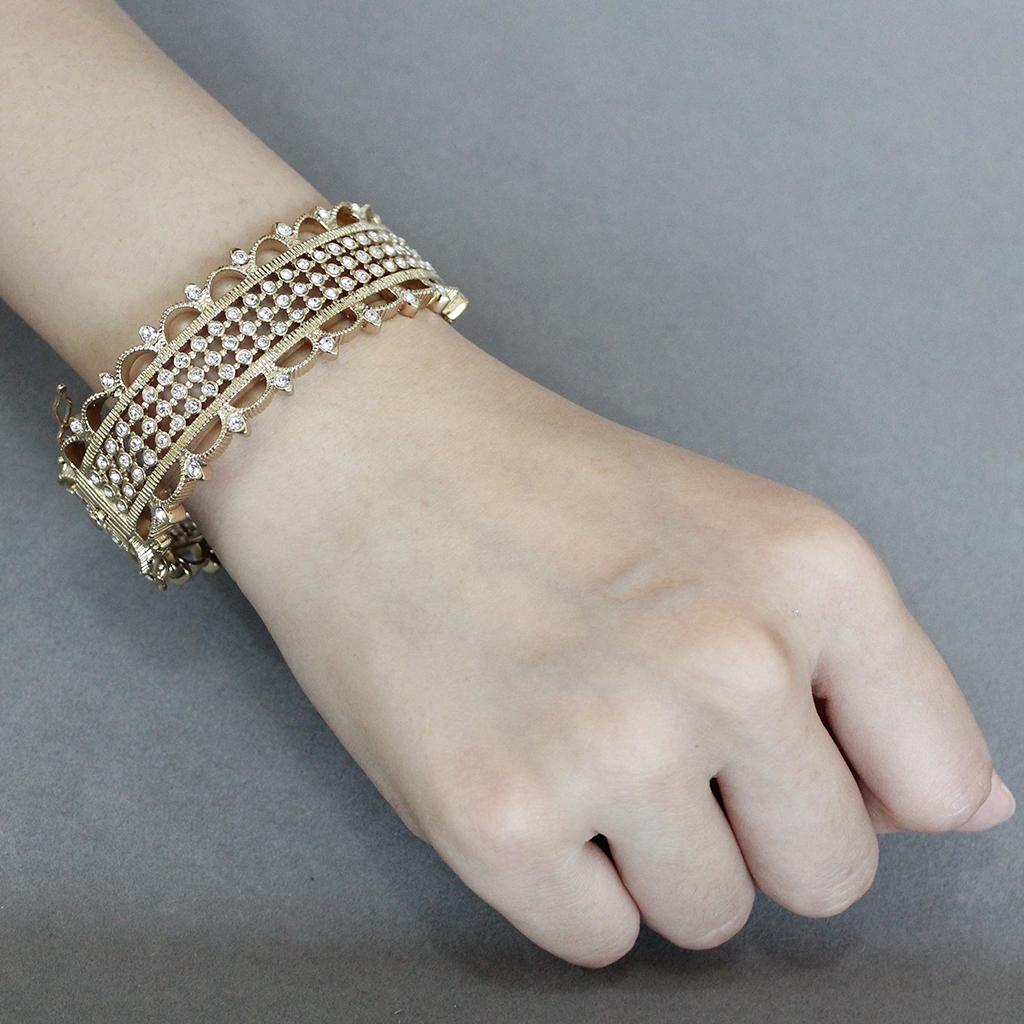 LO4345 Gold Brass Bangle featuring a clear top-grade crystal, elegantly designed for stylish wear.