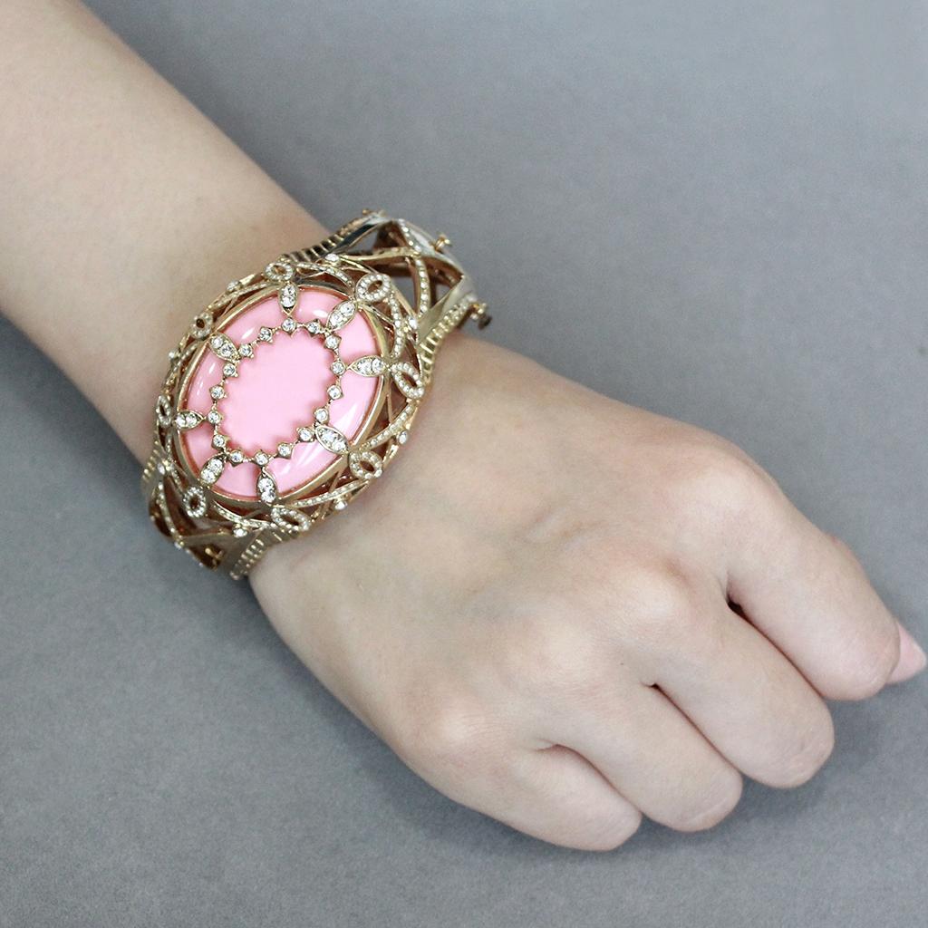 LO4347 Gold Brass Bangle featuring a synthetic rose stone, elegantly designed for stylish accessorizing.