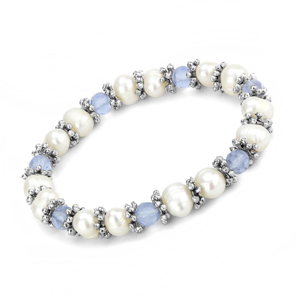 Antique silver white metal bracelet featuring a synthetic sea blue pearl, showcasing intricate design and craftsmanship.