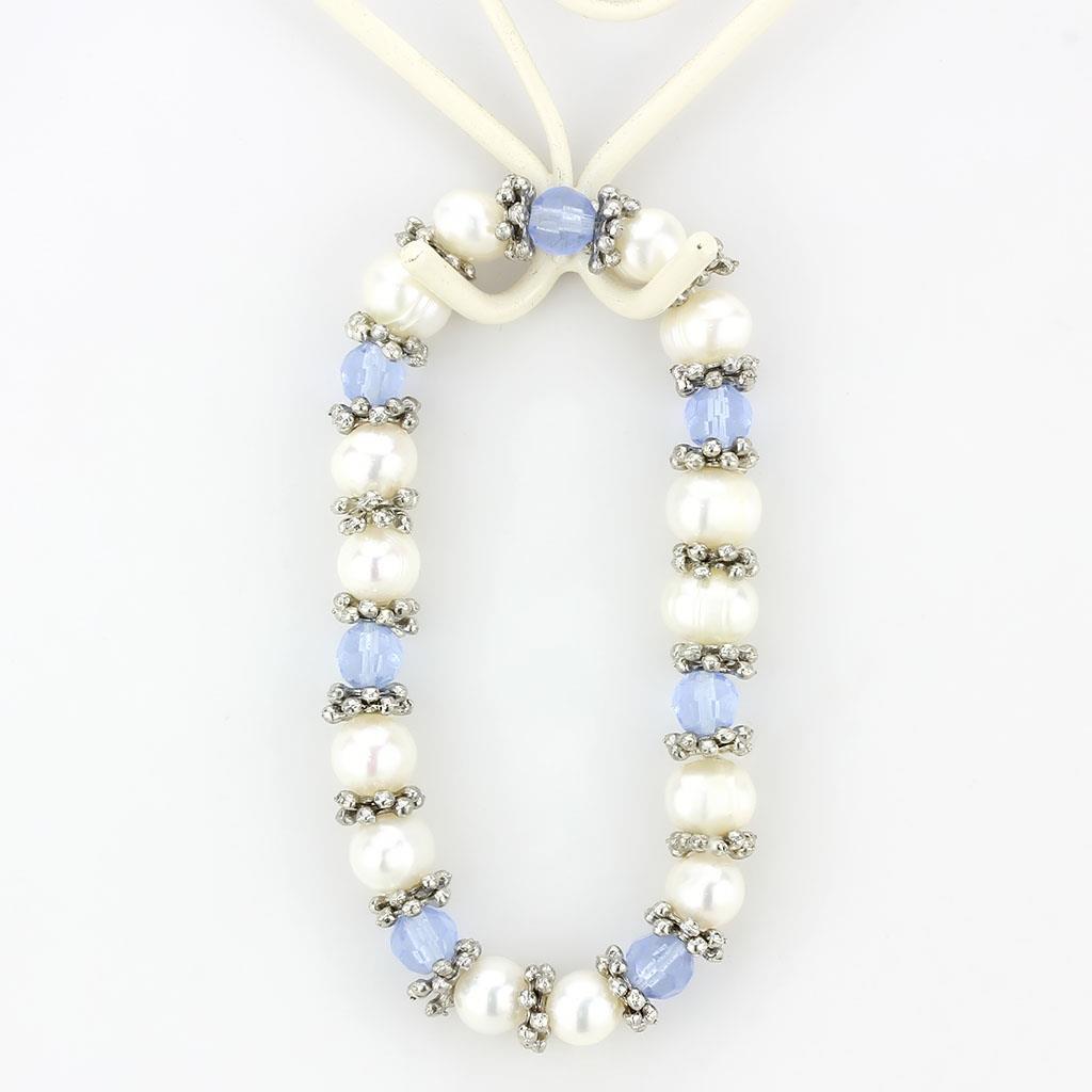 Antique silver white metal bracelet featuring a synthetic sea blue pearl, showcasing intricate design and craftsmanship.