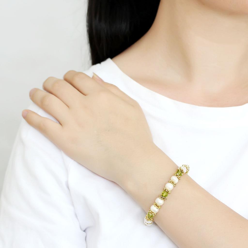 Antique silver white metal bracelet featuring a synthetic pearl centerpiece, showcasing elegant craftsmanship and vintage design.