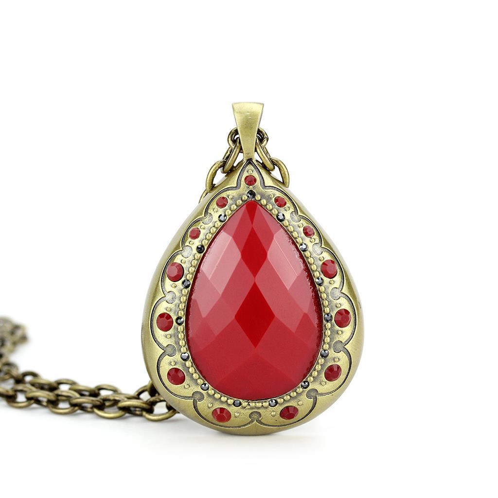 Antique Copper Brass Chain Pendant featuring a vibrant synthetic red stone, elegantly designed for versatile wear.