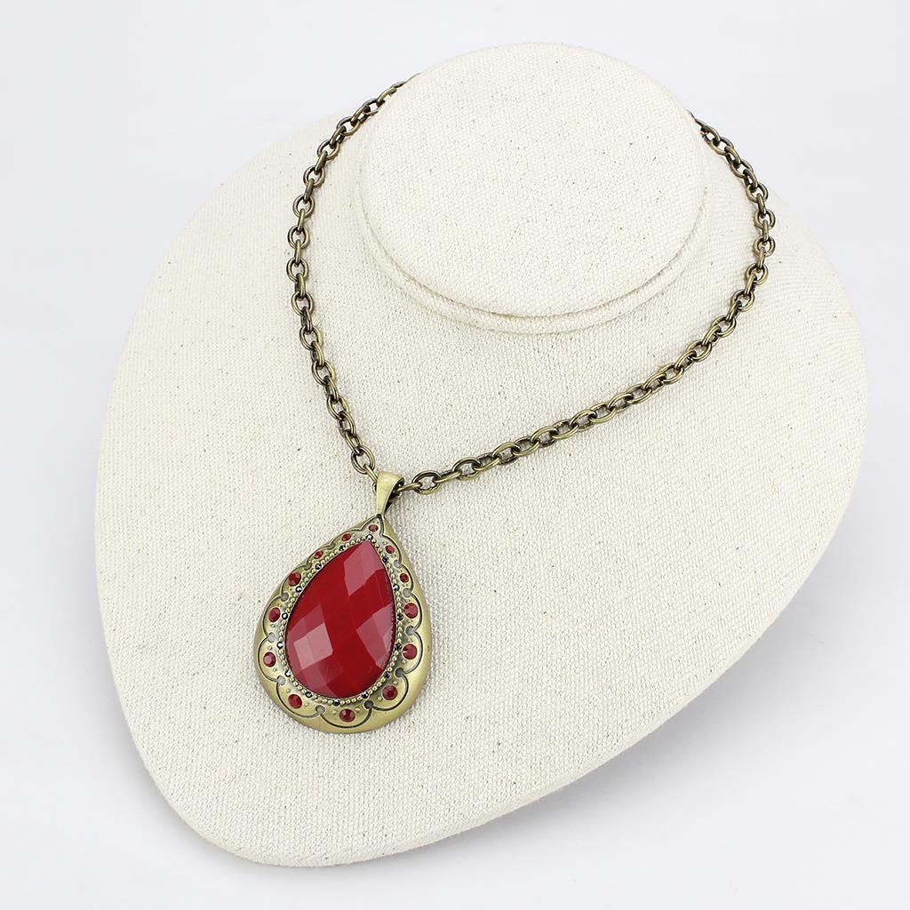 Antique Copper Brass Chain Pendant featuring a vibrant synthetic red stone, elegantly designed for versatile wear.