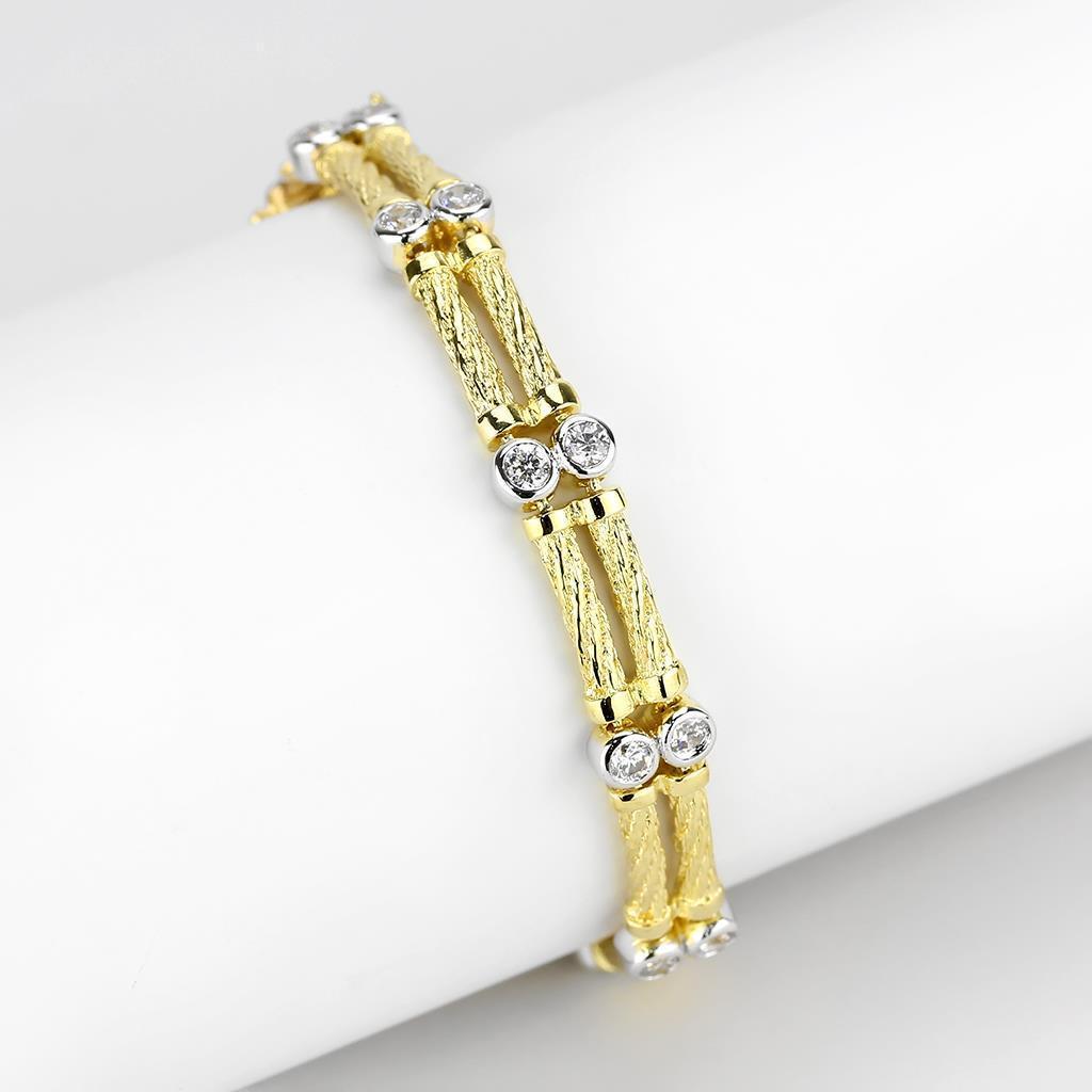 Gold and rhodium brass bracelet featuring a clear AAA grade cubic zirconia stone, elegantly designed for any occasion.