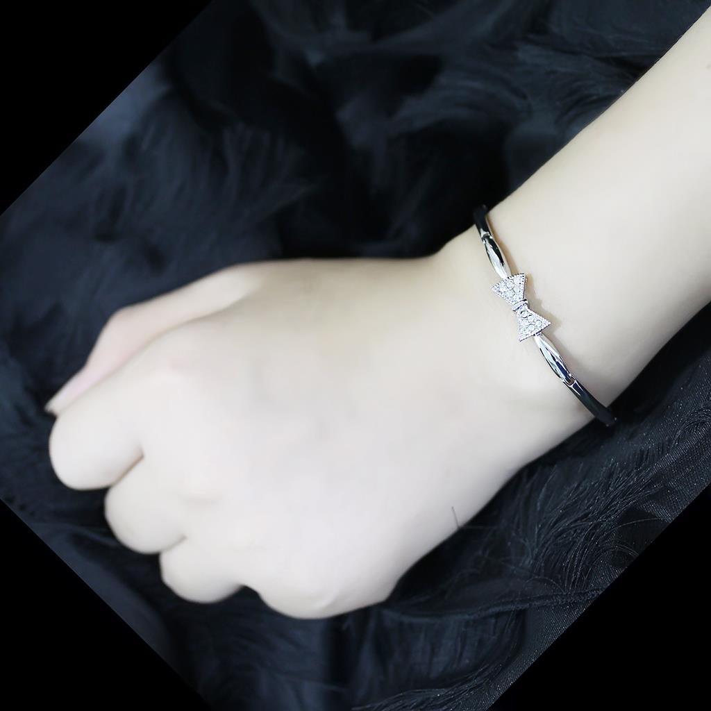 Rhodium brass bracelet featuring a clear top grade crystal centerpiece, showcasing elegance and sophistication.