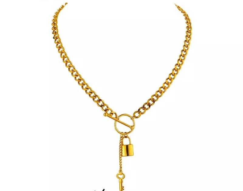 Elegant lock and key necklace featuring a Cuban link chain and toggle clasp, crafted from 18K gold plated stainless steel.