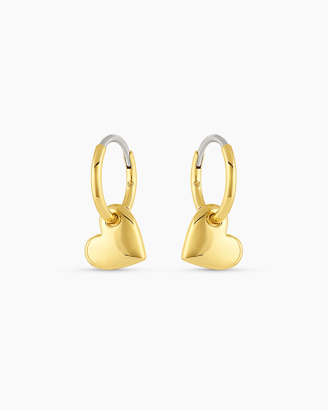Lou Heart Huggies earrings featuring a charming heart-shaped design, lightweight and stylish for everyday wear.