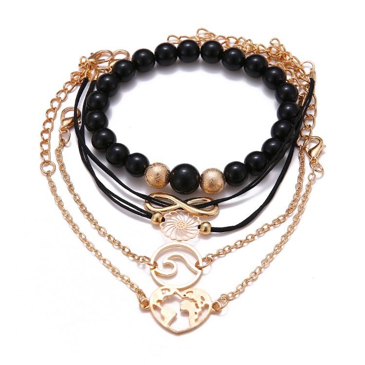 Love & Peace Throughout The World Marble 5 Piece Set featuring 14K gold plating and black marble stretch bracelet, designed in Italy.