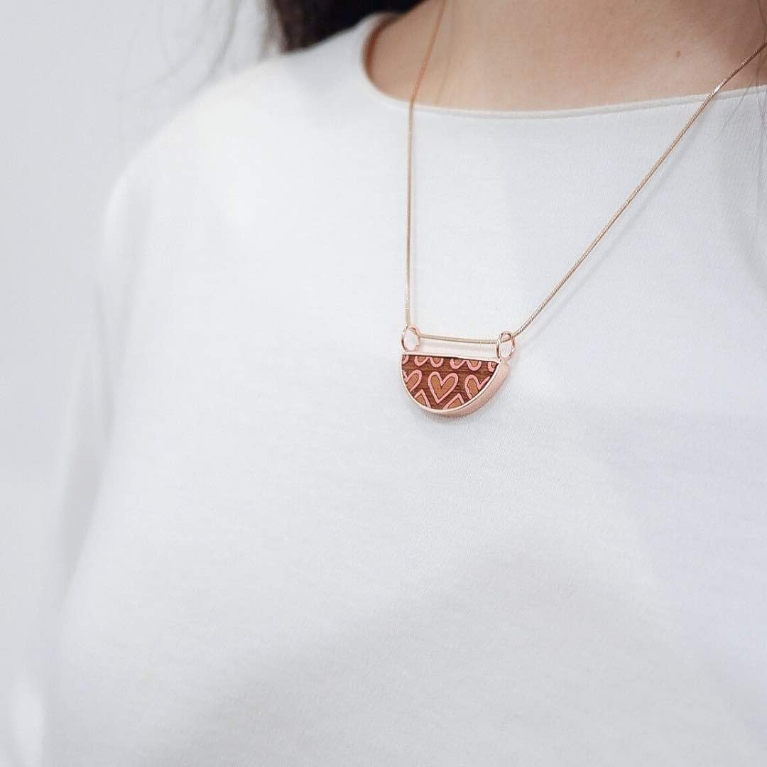 Handmade Love Recycled Wood Rose Gold Necklace featuring a unique wooden pendant and rose gold plated chain, elegantly displayed in a luxury gift box.