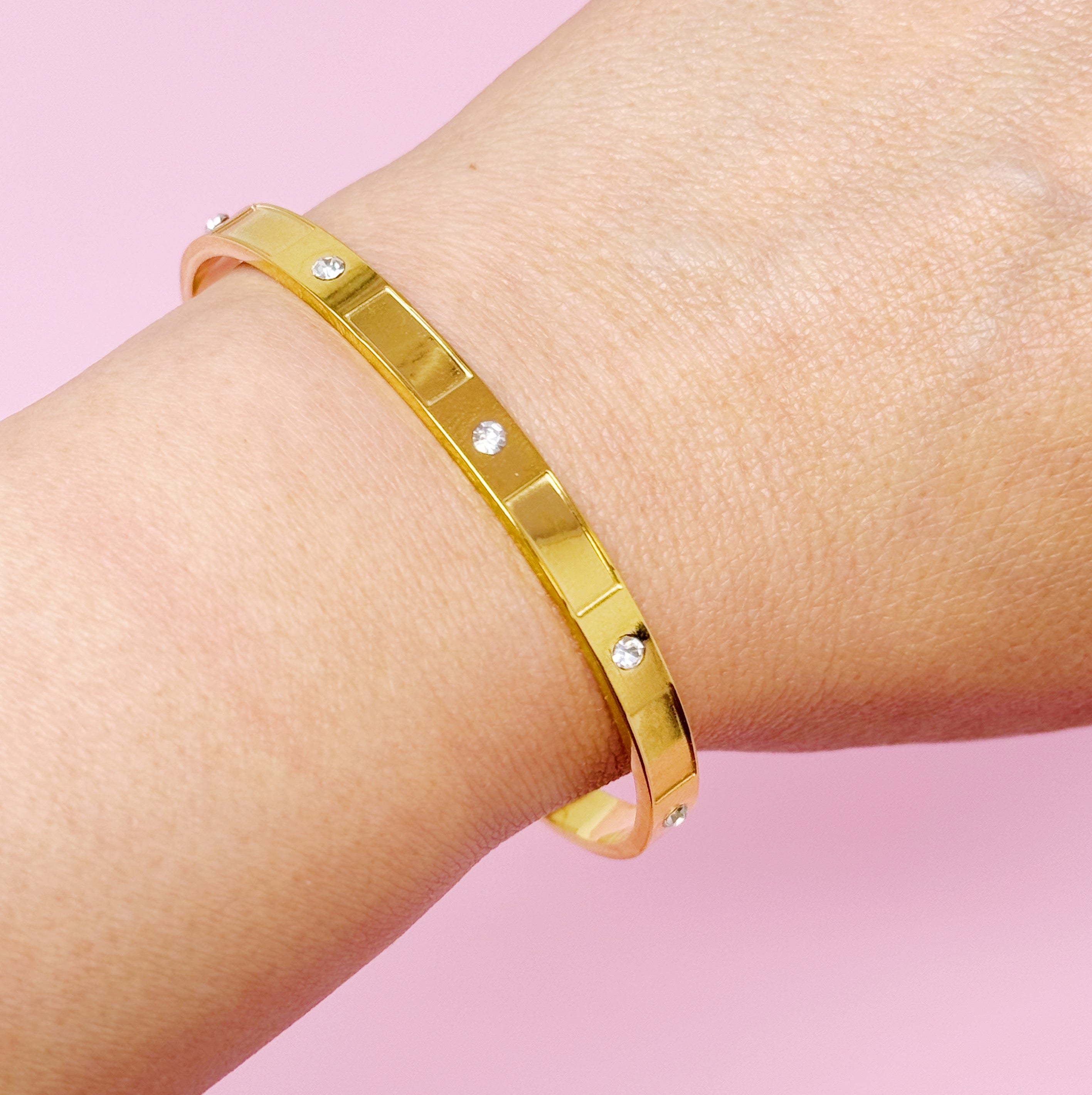 Lovely Open Bangle featuring intricate detailing and a modern open design, crafted from 18k gold plated stainless steel.