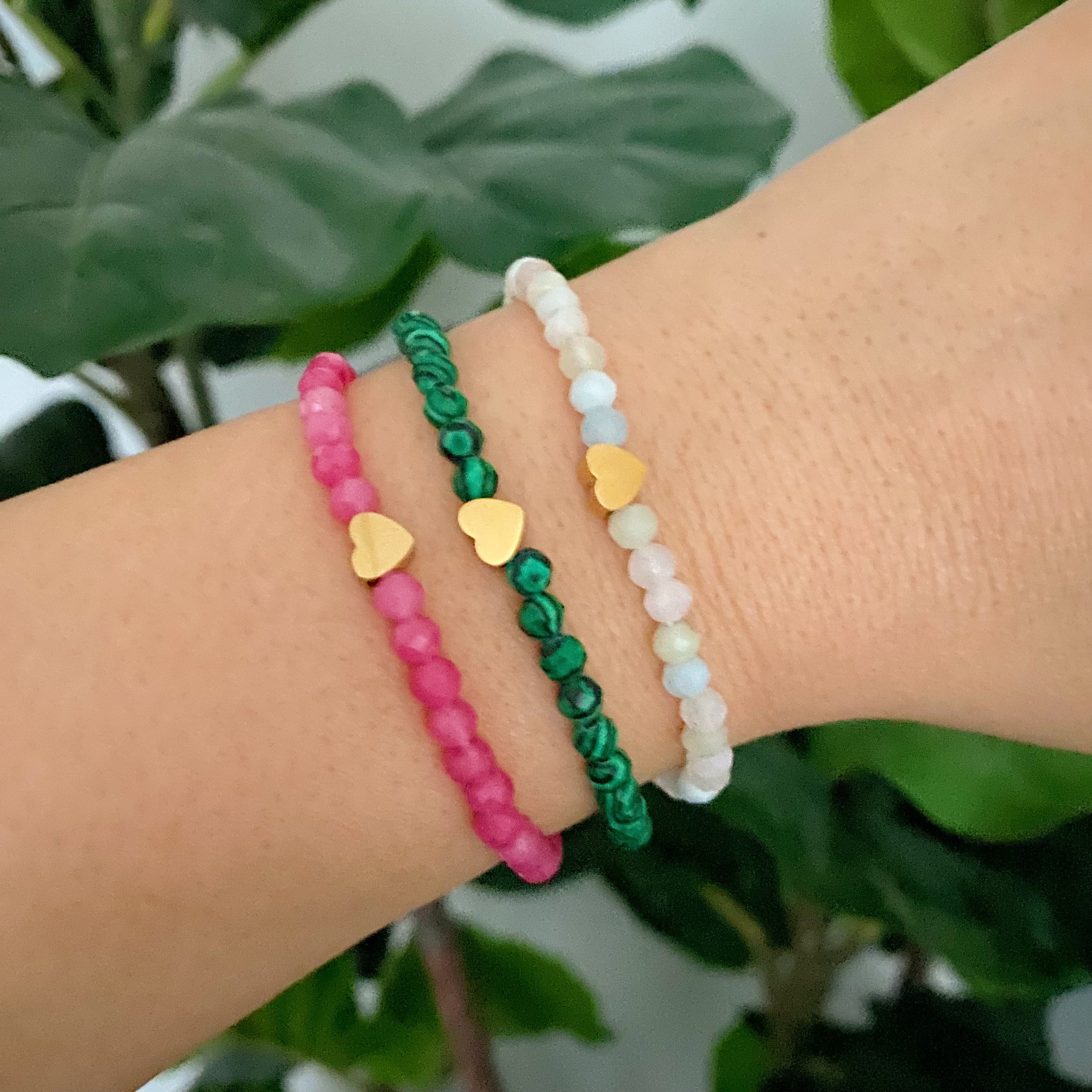 Lovely Stone Beads Stretch Bracelet featuring natural stone beads and a golden heart bead, showcasing its elegant design.