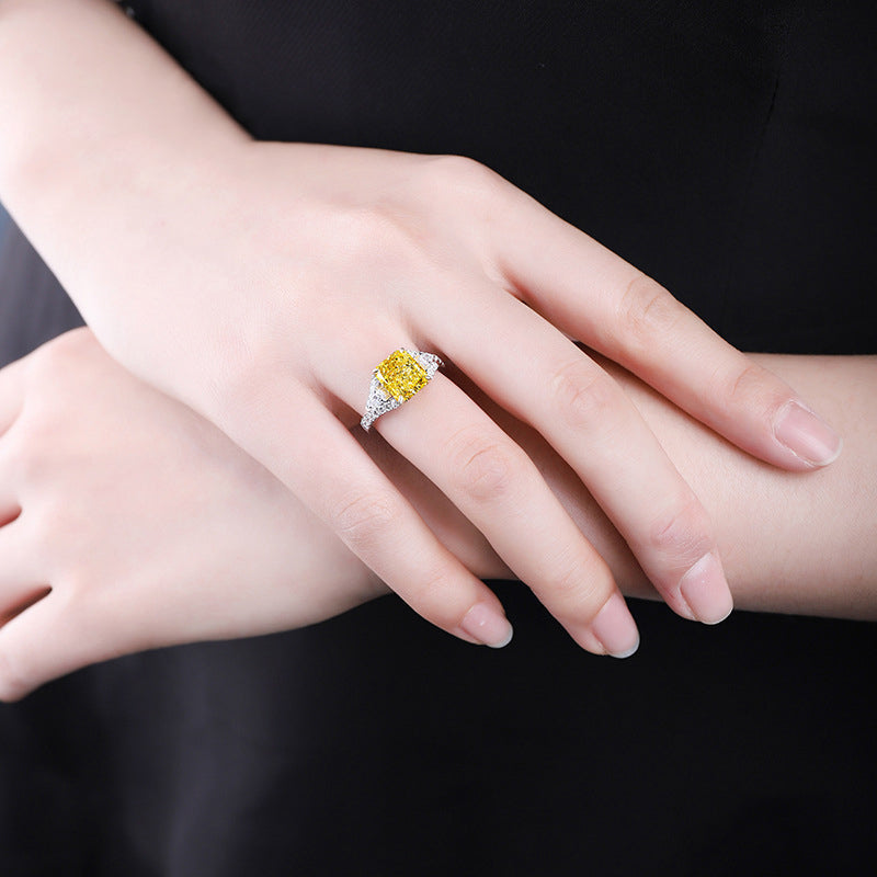 Lovely yellow citrine ring set in 925 sterling silver with white sapphire accents, showcasing its vibrant color and elegant design.