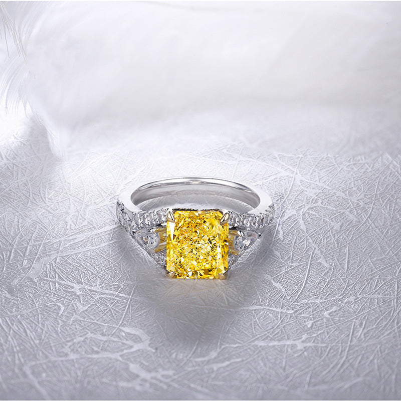 Lovely yellow citrine ring set in 925 sterling silver with white sapphire accents, showcasing its vibrant color and elegant design.