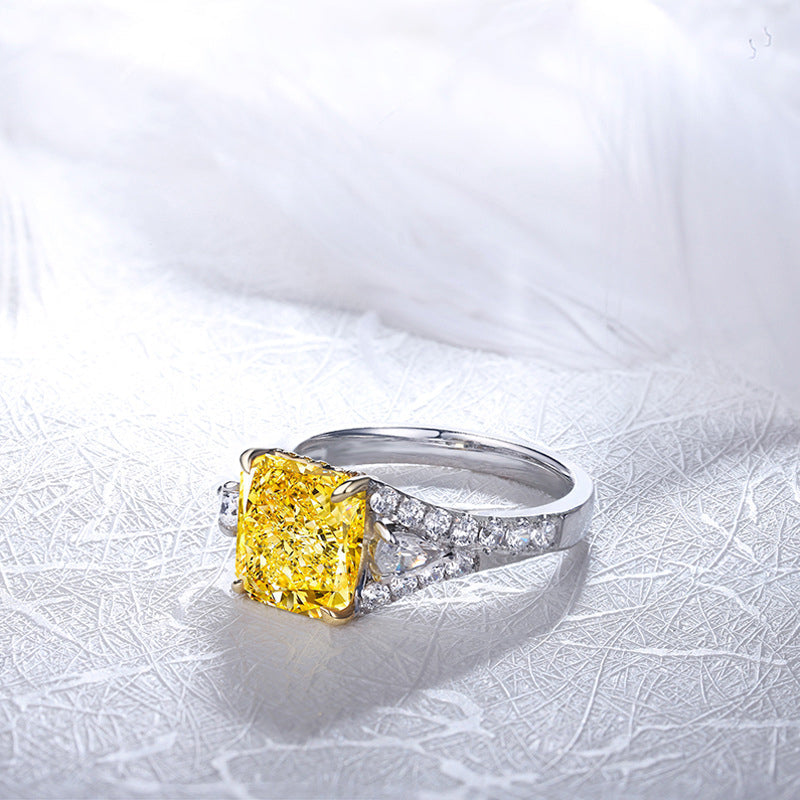 Lovely yellow citrine ring set in 925 sterling silver with white sapphire accents, showcasing its vibrant color and elegant design.
