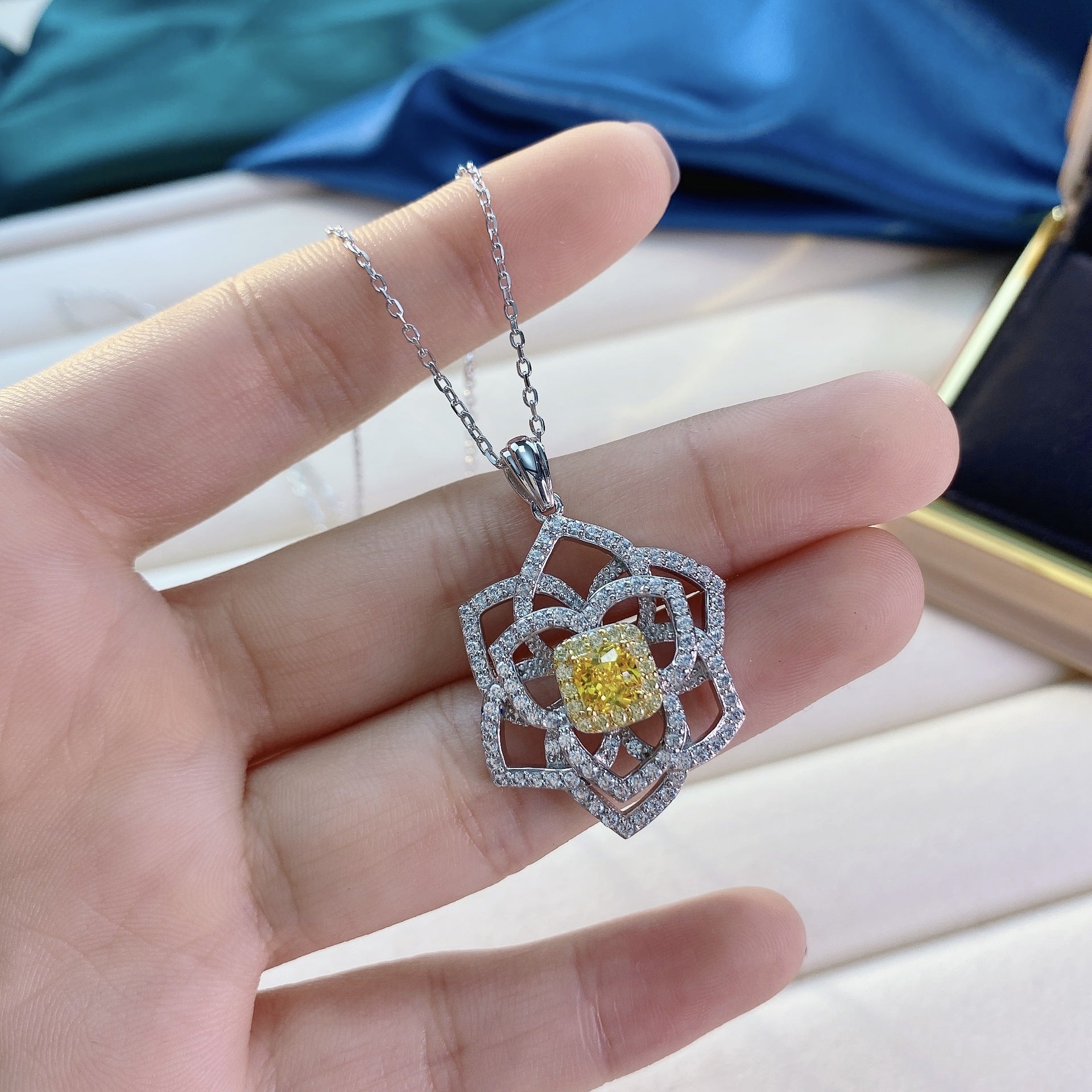 A stunning yellow citrine necklace featuring a flower design, crafted from 925 sterling silver and filled with real white gold.