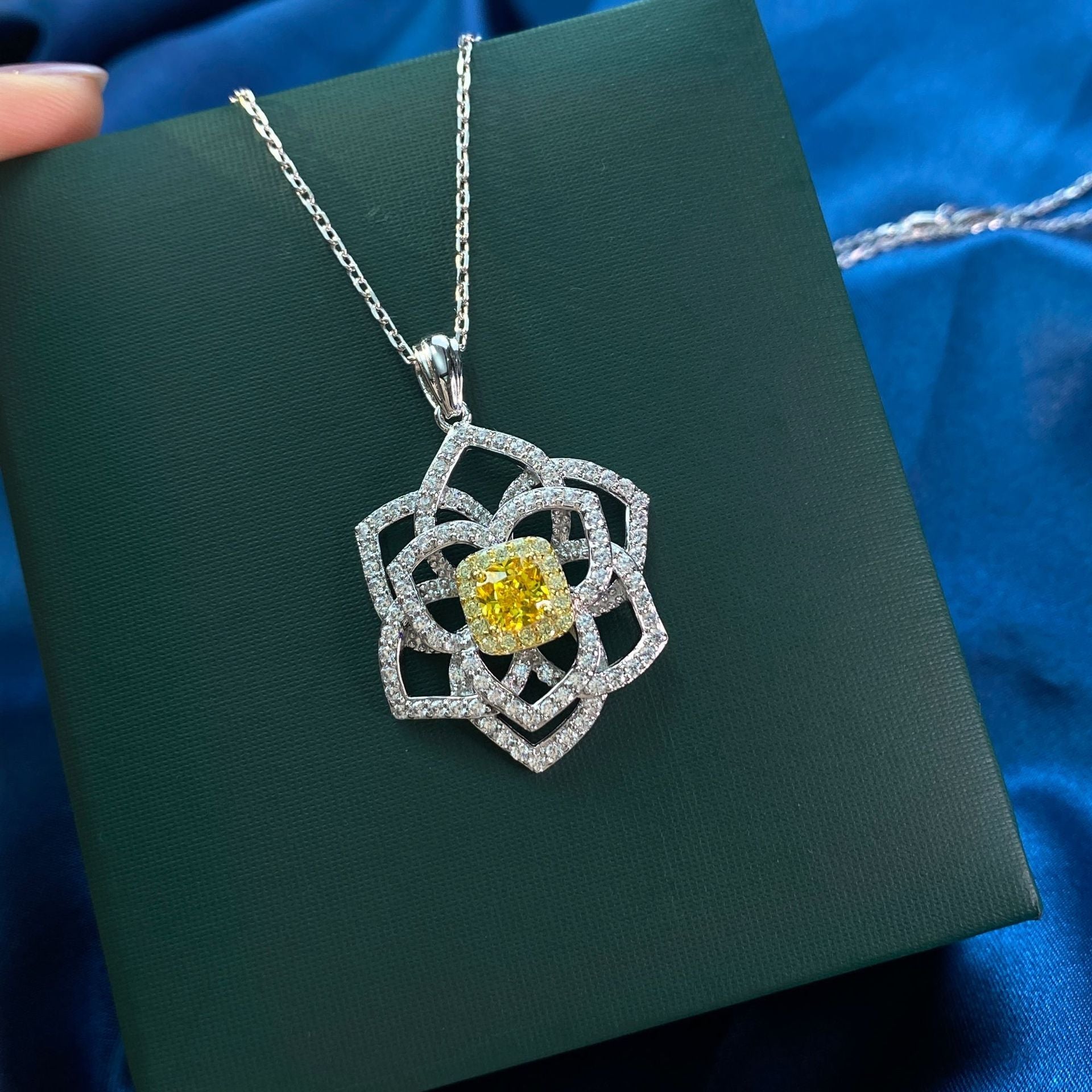 A stunning yellow citrine necklace featuring a flower design, crafted from 925 sterling silver and filled with real white gold.