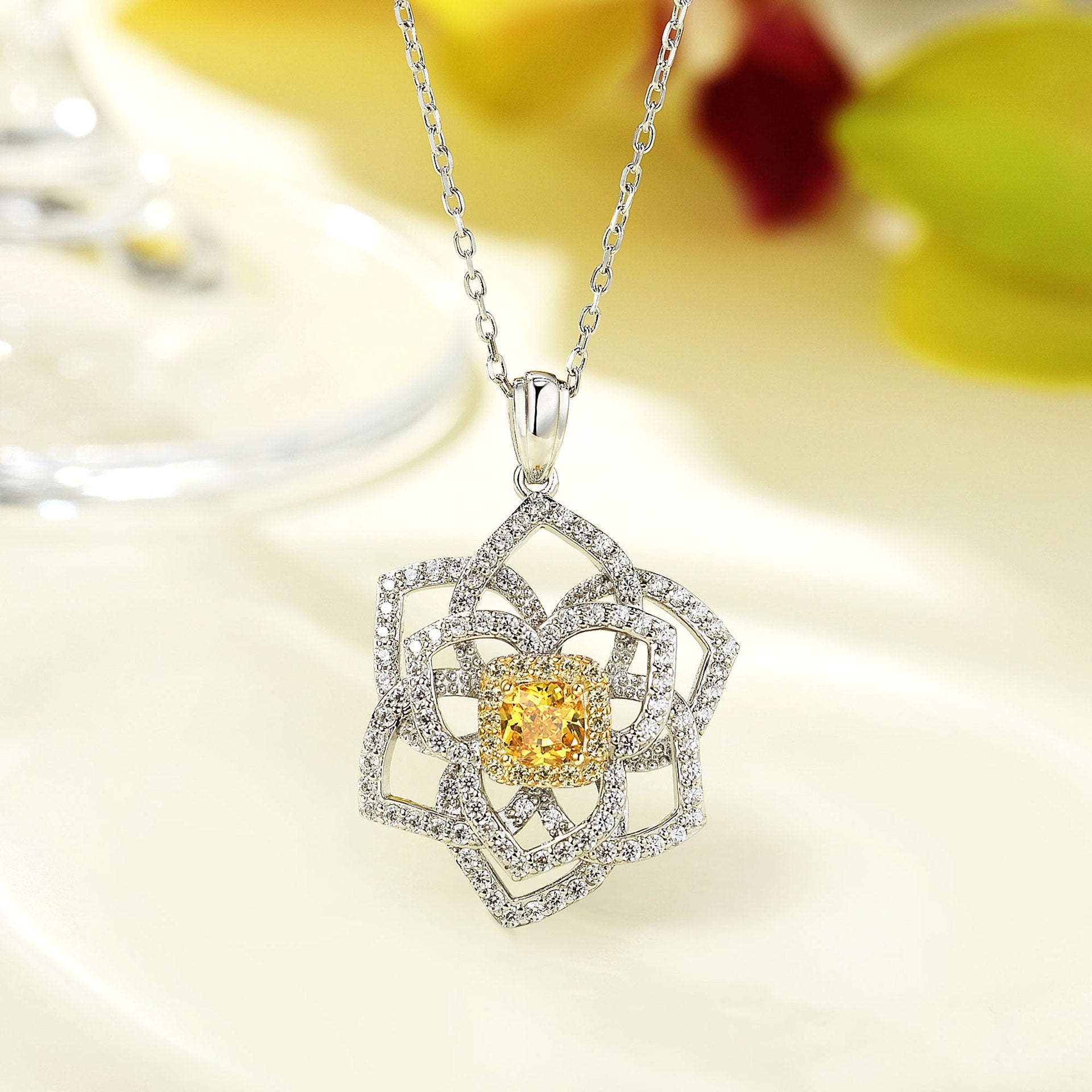 A stunning yellow citrine necklace featuring a flower design, crafted from 925 sterling silver and filled with real white gold.