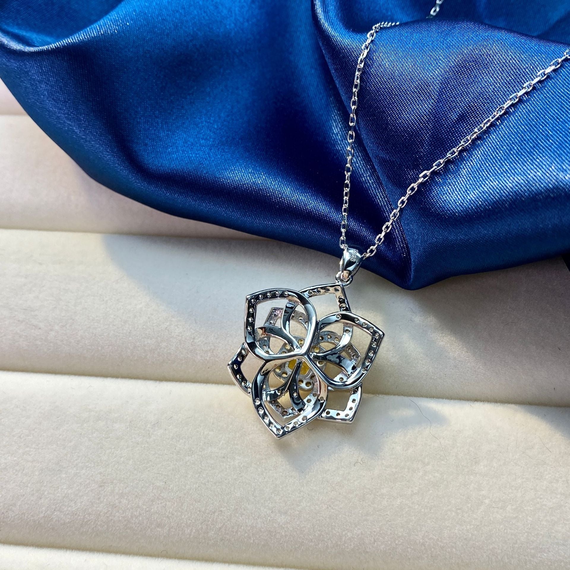 A stunning yellow citrine necklace featuring a flower design, crafted from 925 sterling silver and filled with real white gold.