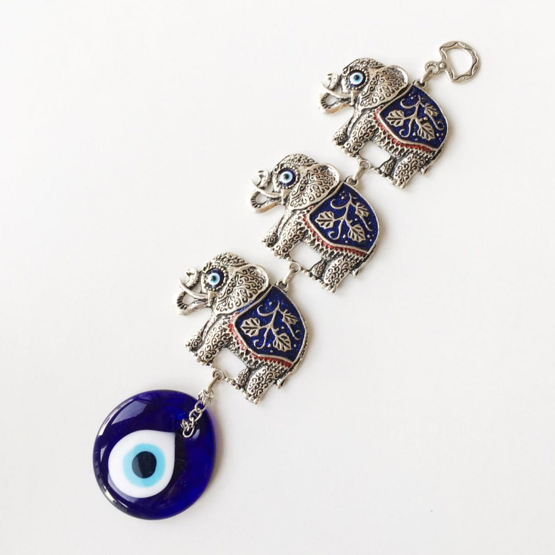 Handmade Lucky Elephant Evil Eye Wall Decor featuring a metal elephant and glass evil eye, symbolizing protection and good luck.