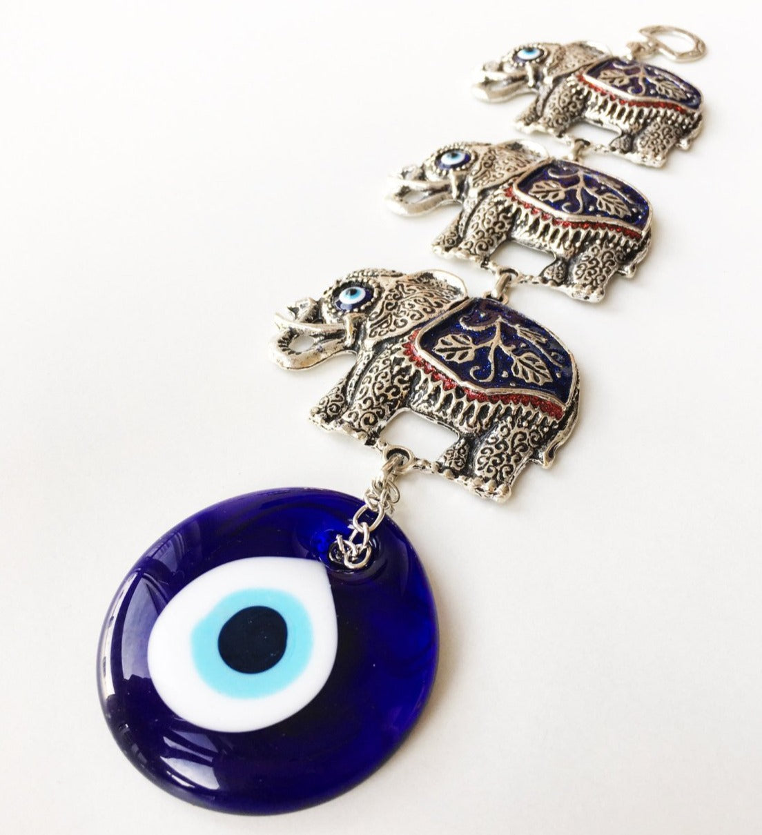 Handmade Lucky Elephant Evil Eye Wall Decor featuring a metal elephant and glass evil eye, symbolizing protection and good luck.