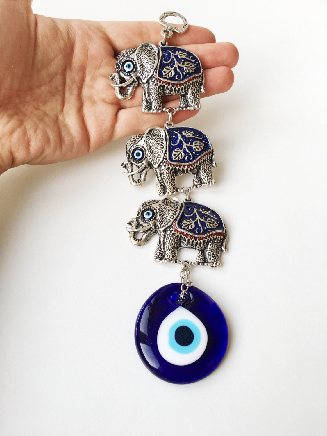 Handmade Lucky Elephant Evil Eye Wall Decor featuring a metal elephant and glass evil eye, symbolizing protection and good luck.