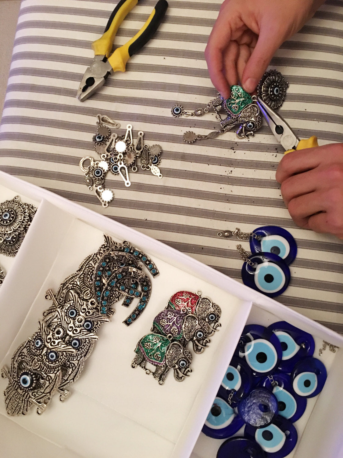 Handmade Lucky Elephant Evil Eye Wall Decor featuring a metal elephant and glass evil eye, symbolizing protection and good luck.