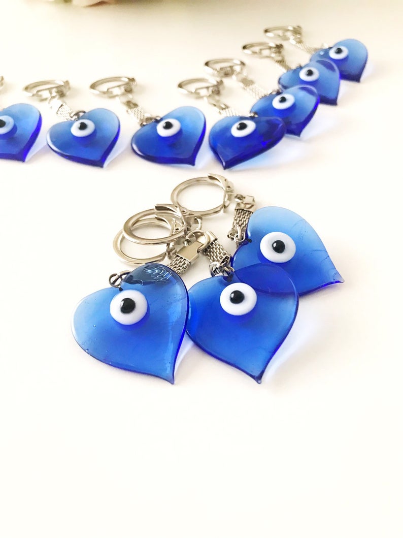 Lucky Evil Eye Greek Keychain featuring a glass evil eye bead and various charm styles.