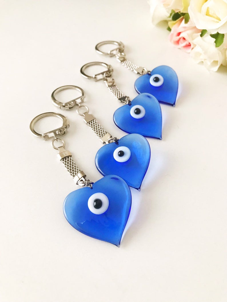 Lucky Evil Eye Greek Keychain featuring a glass evil eye bead and various charm styles.