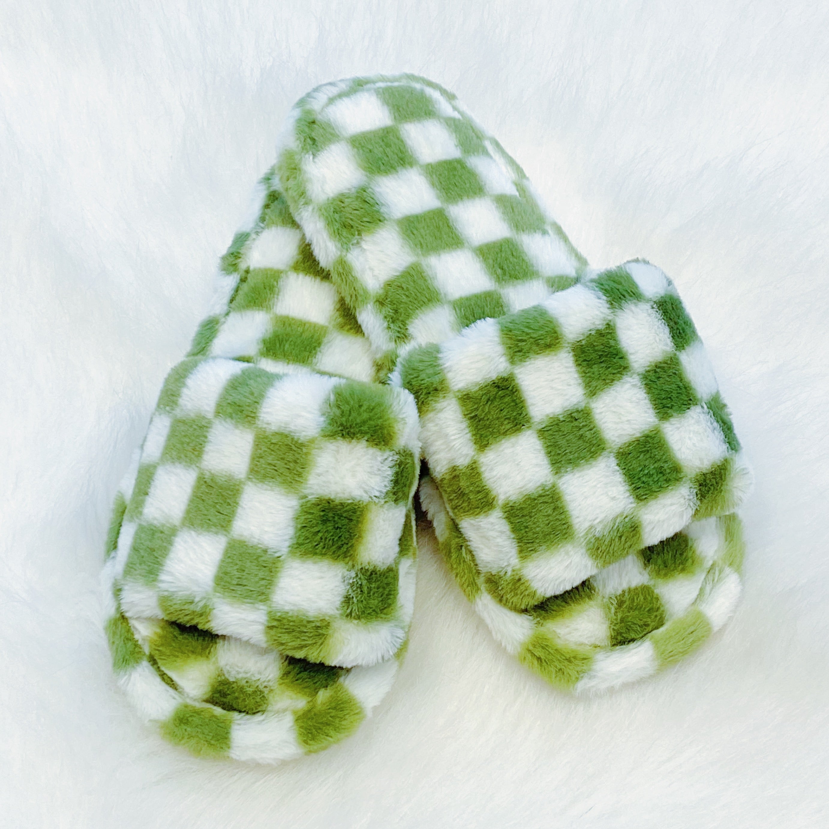 Luxe Lounge Checker Cozy Slippers featuring a stylish checker pattern and open toe design, perfect for comfort and relaxation.
