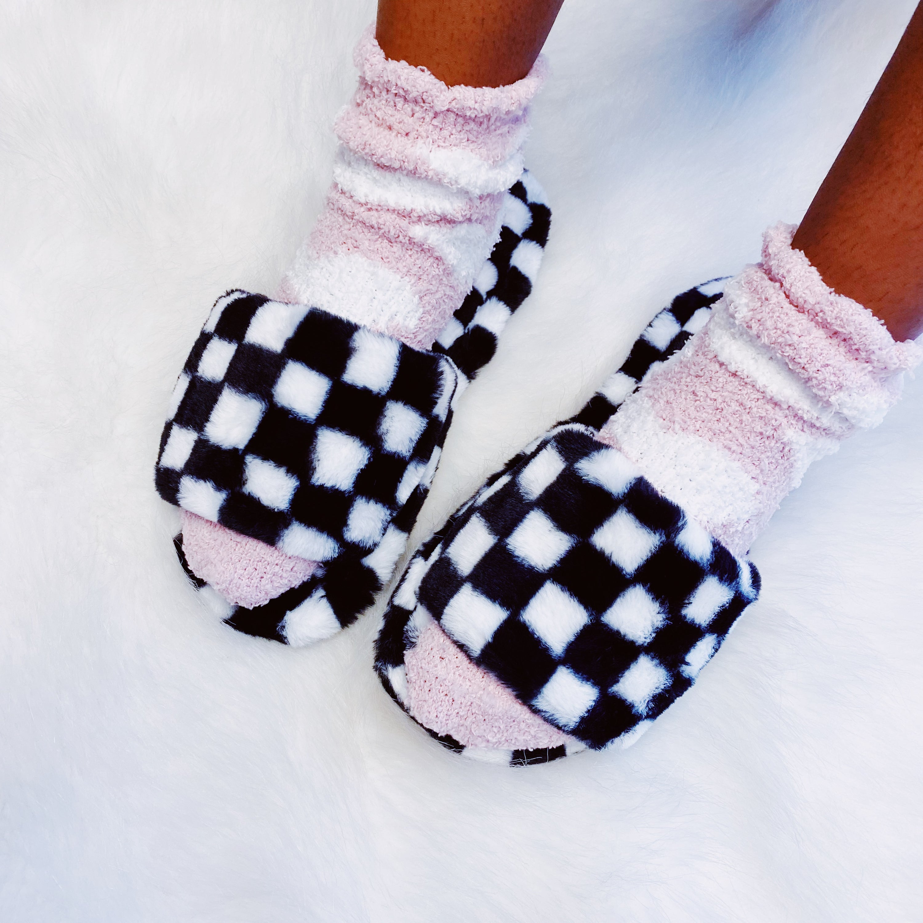 Luxe Lounge Checker Cozy Slippers featuring a stylish checker pattern and open toe design, perfect for comfort and relaxation.