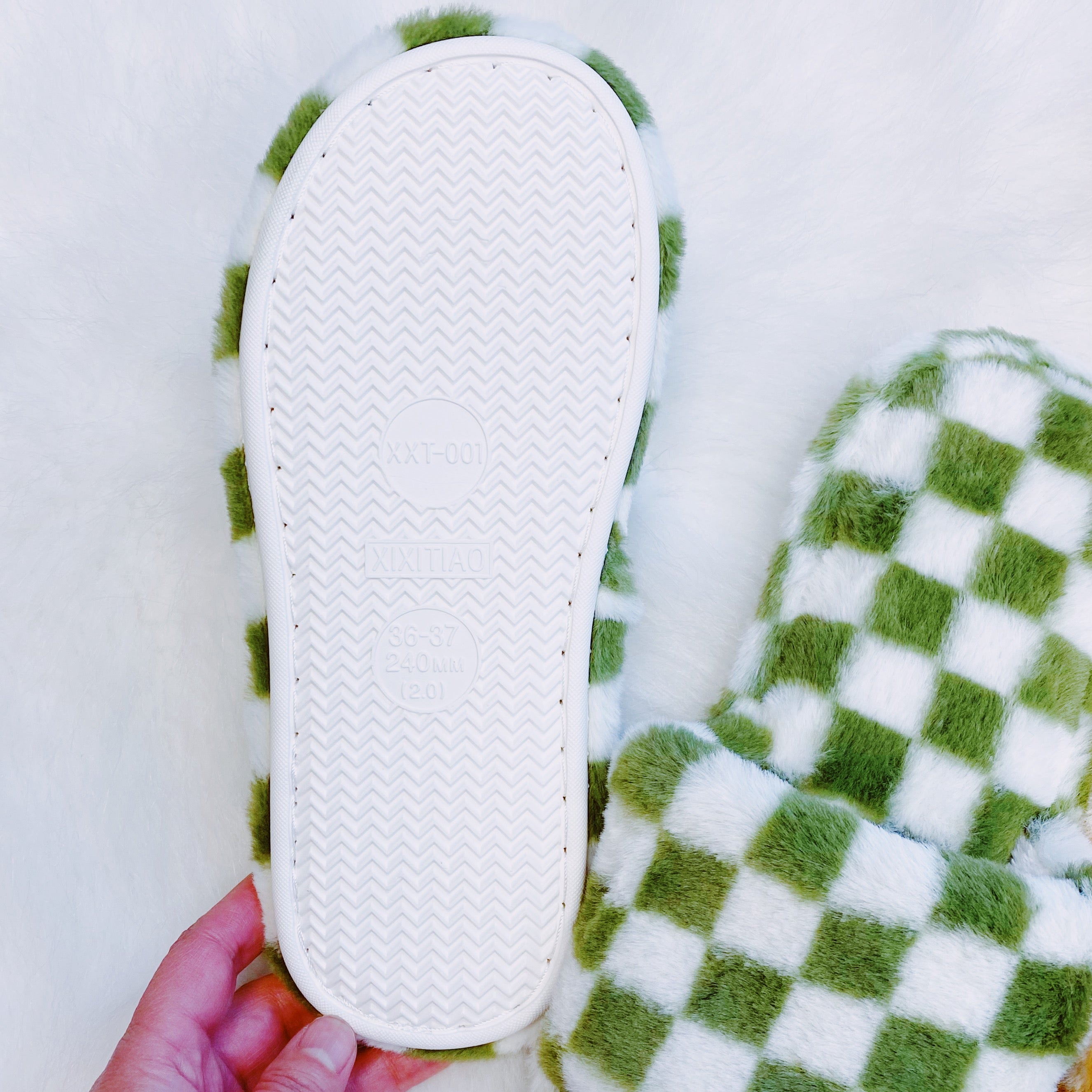 Luxe Lounge Checker Cozy Slippers featuring a stylish checker pattern and open toe design, perfect for comfort and relaxation.