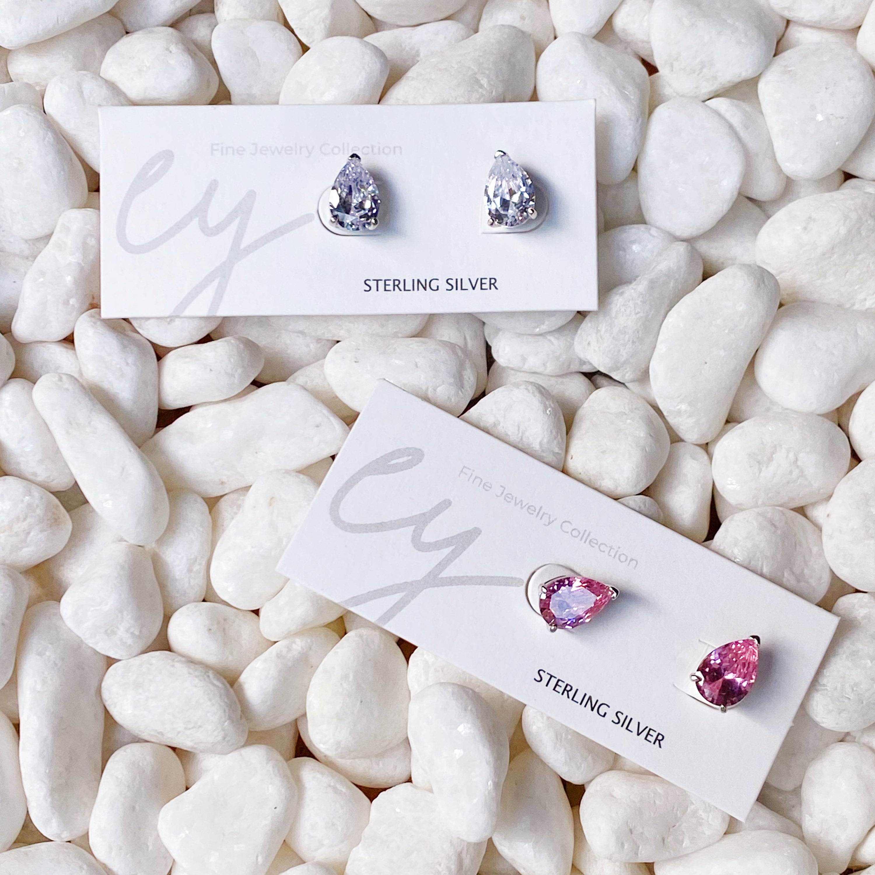 Luxe Teardrop Sterling Silver Stud Earrings with sparkling Cubic Zirconia stones, showcasing elegant teardrop design.