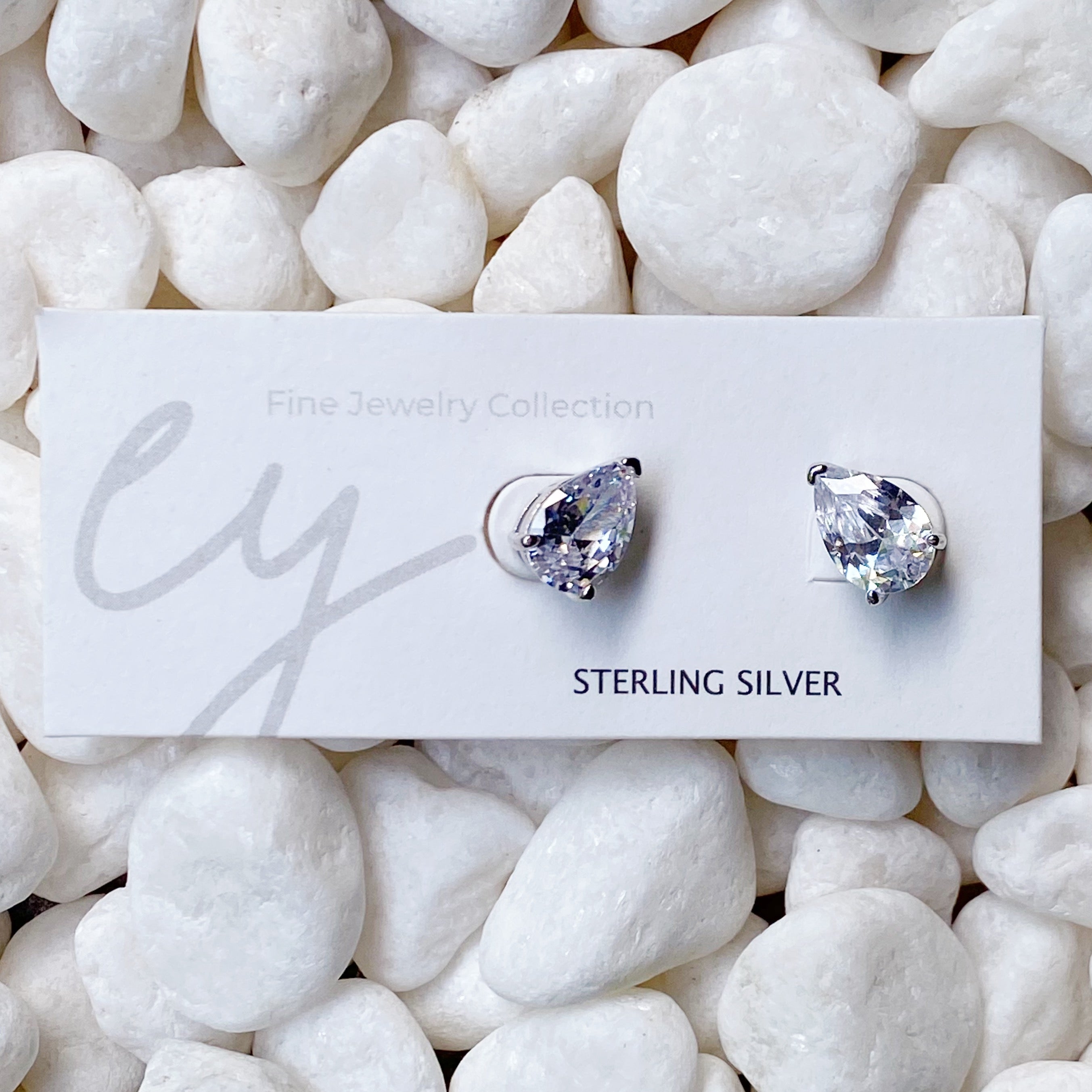 Luxe Teardrop Sterling Silver Stud Earrings with sparkling Cubic Zirconia stones, showcasing elegant teardrop design.