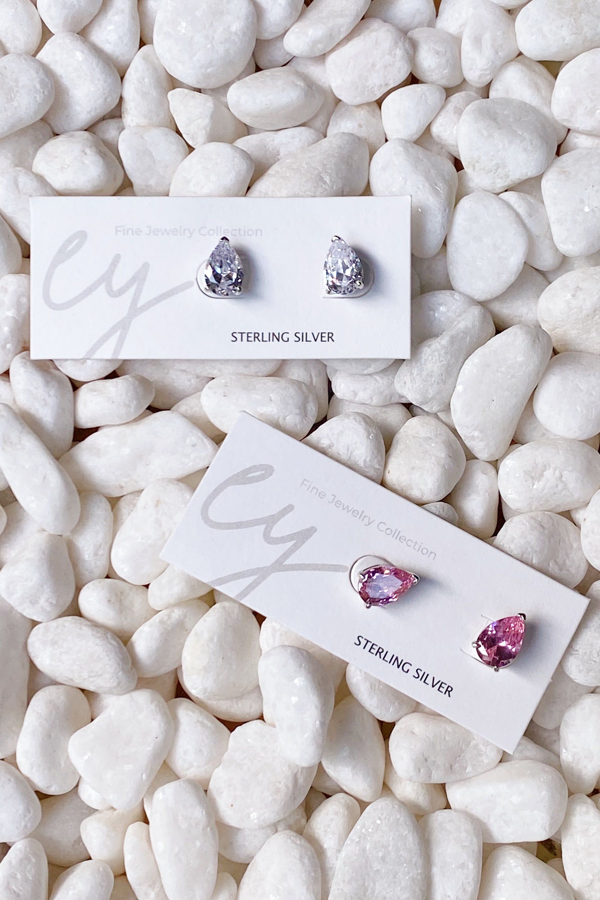 Luxe Teardrop Sterling Silver Stud Earrings with sparkling Cubic Zirconia stones, showcasing elegant teardrop design.