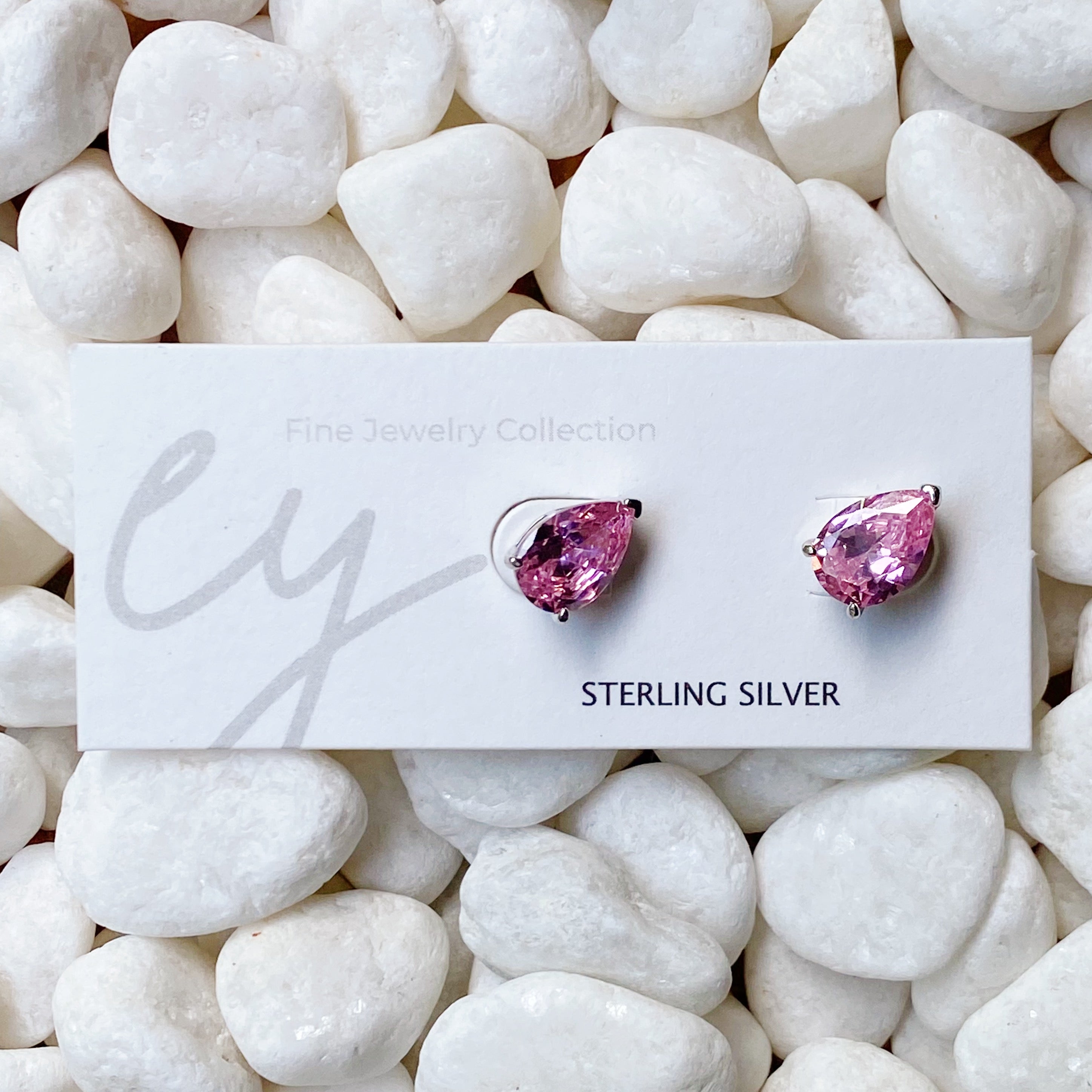 Luxe Teardrop Sterling Silver Stud Earrings with sparkling Cubic Zirconia stones, showcasing elegant teardrop design.