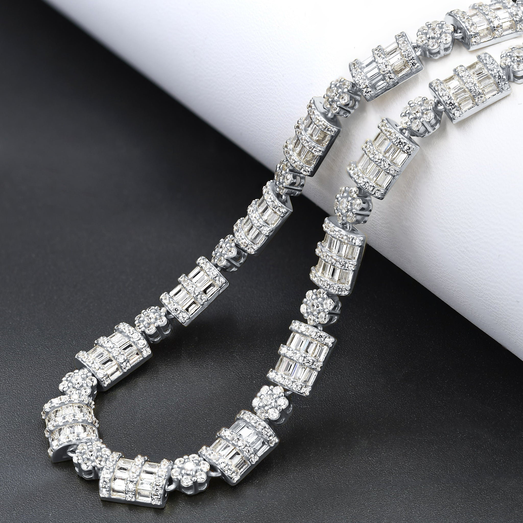 LUXURIA Silver Iced Out CZ 8MM Chain featuring sparkling cubic zirconia stones set in 925 sterling silver, showcasing a bold and elegant design.
