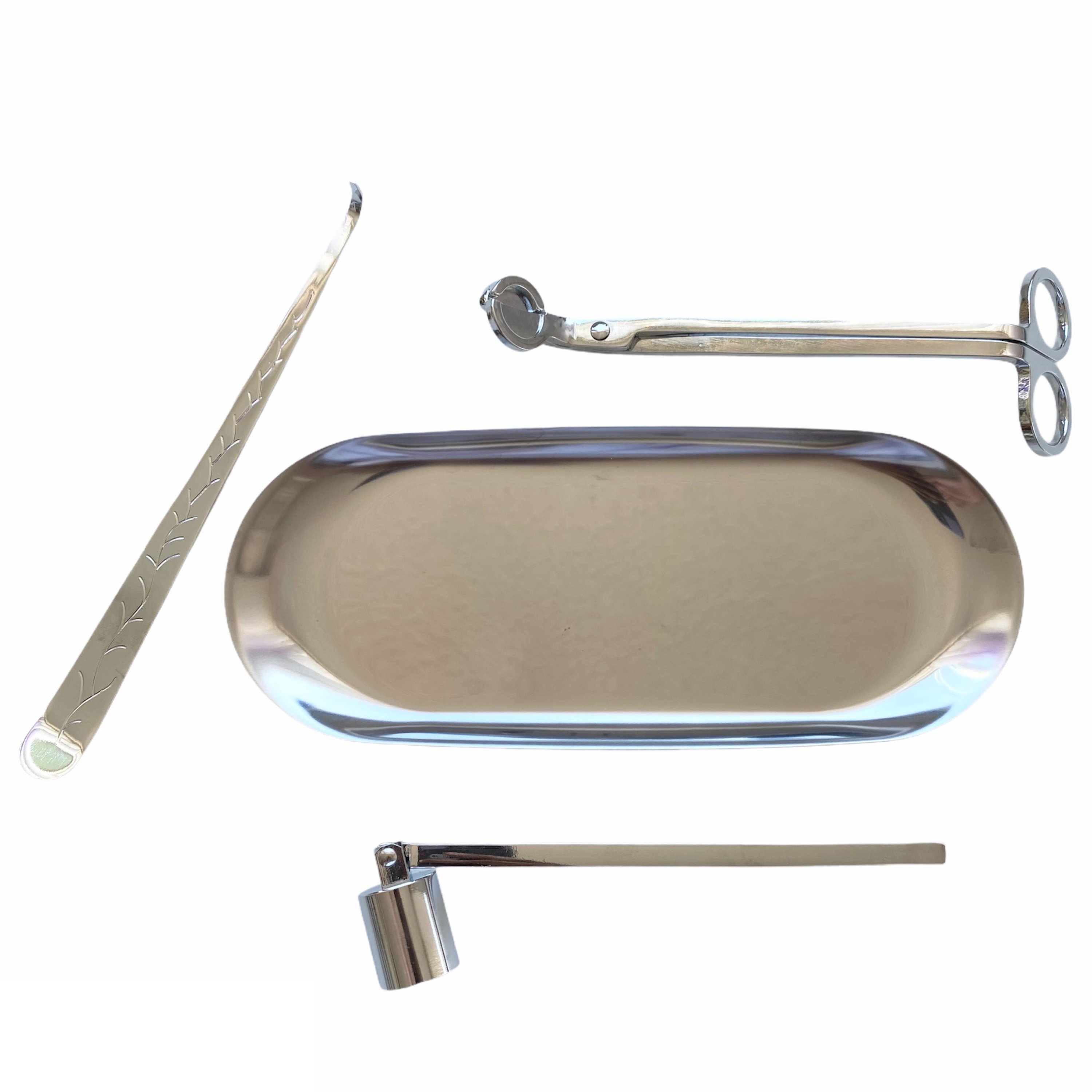 Luxury Candle Maintenance Kit featuring a wick trimmer, snuffer, wick dipper, and tray in gold and silver finishes.