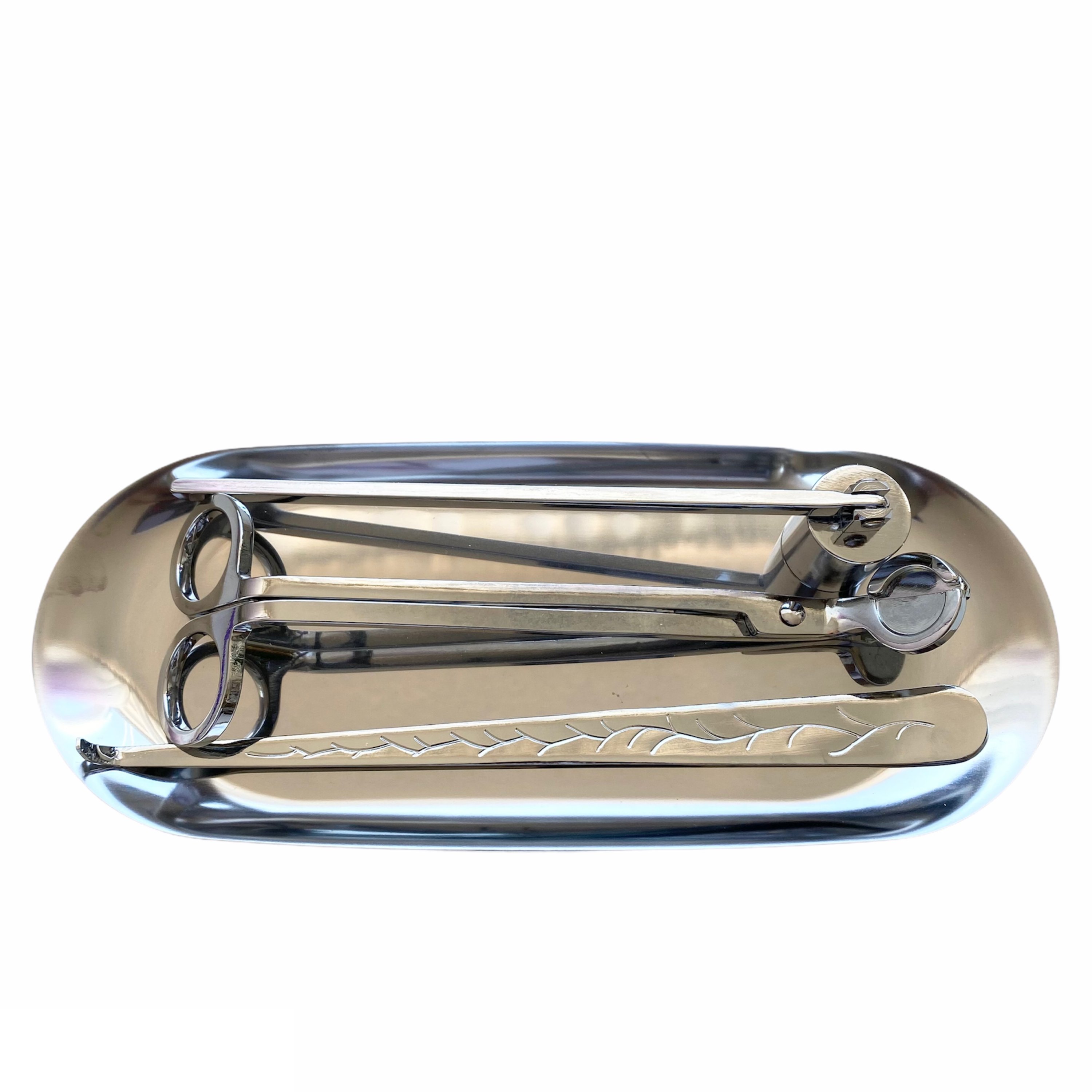 Luxury Candle Maintenance Kit featuring a wick trimmer, snuffer, wick dipper, and tray in gold and silver finishes.