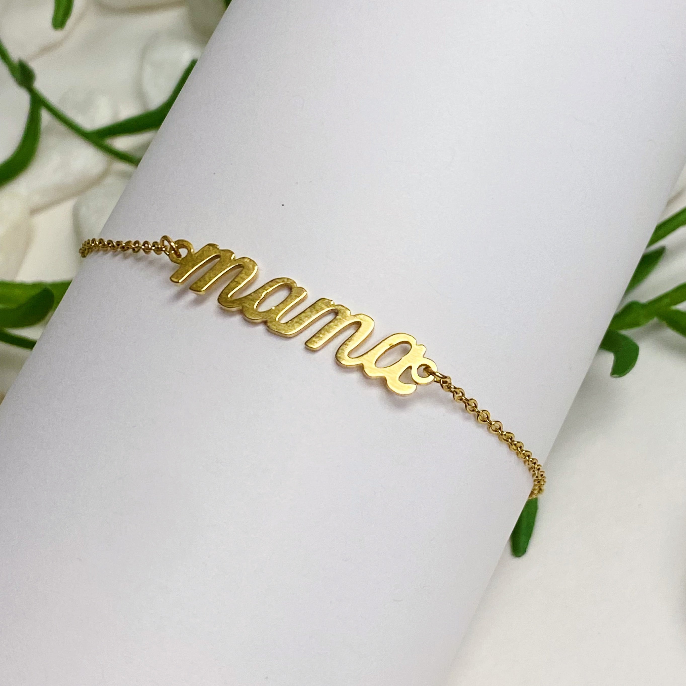 Mama Drawstring Bracelet featuring 'MAMA' in elegant font on a dainty sliding chain, made of 18k gold plated brass.