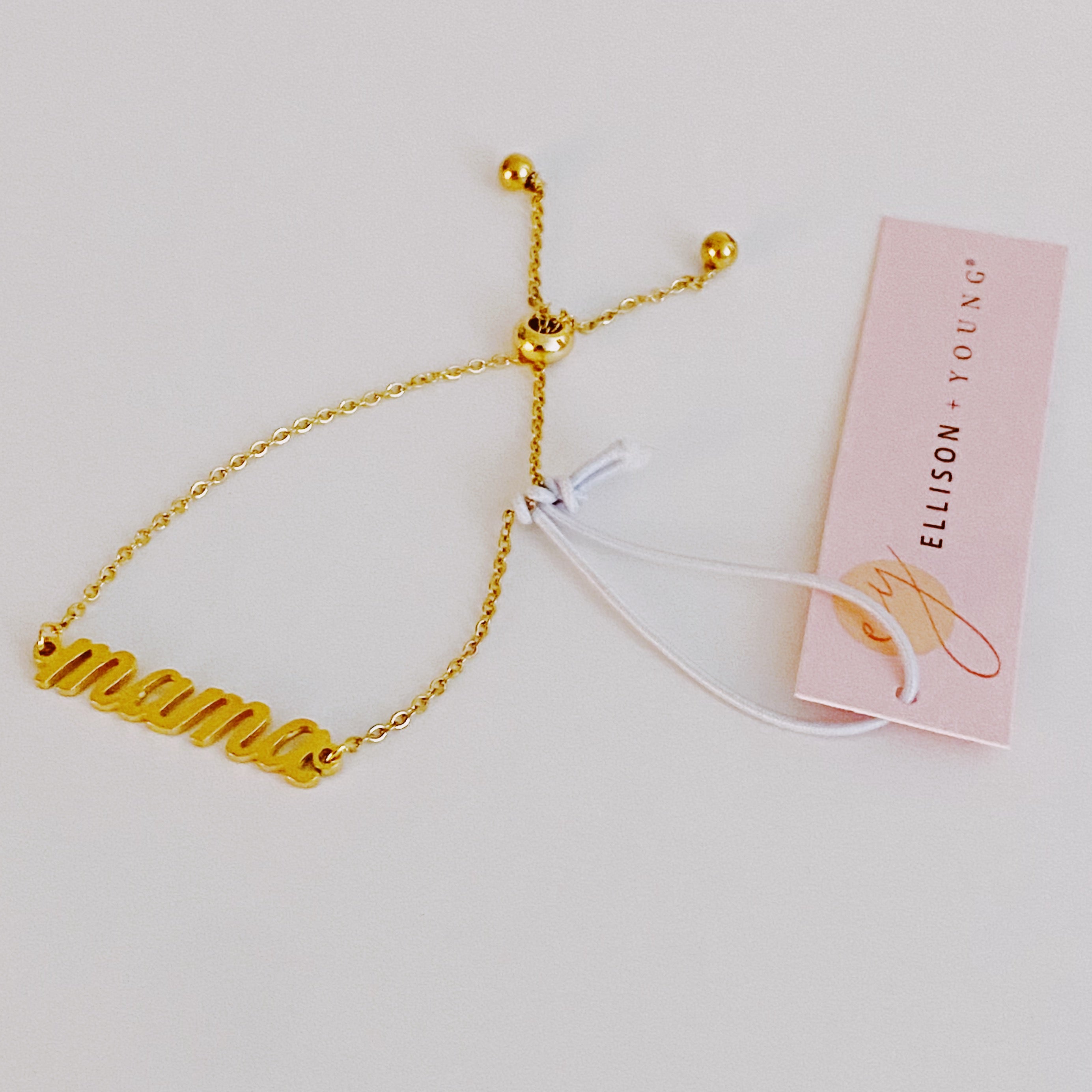 Mama Drawstring Bracelet featuring 'MAMA' in elegant font on a dainty sliding chain, made of 18k gold plated brass.