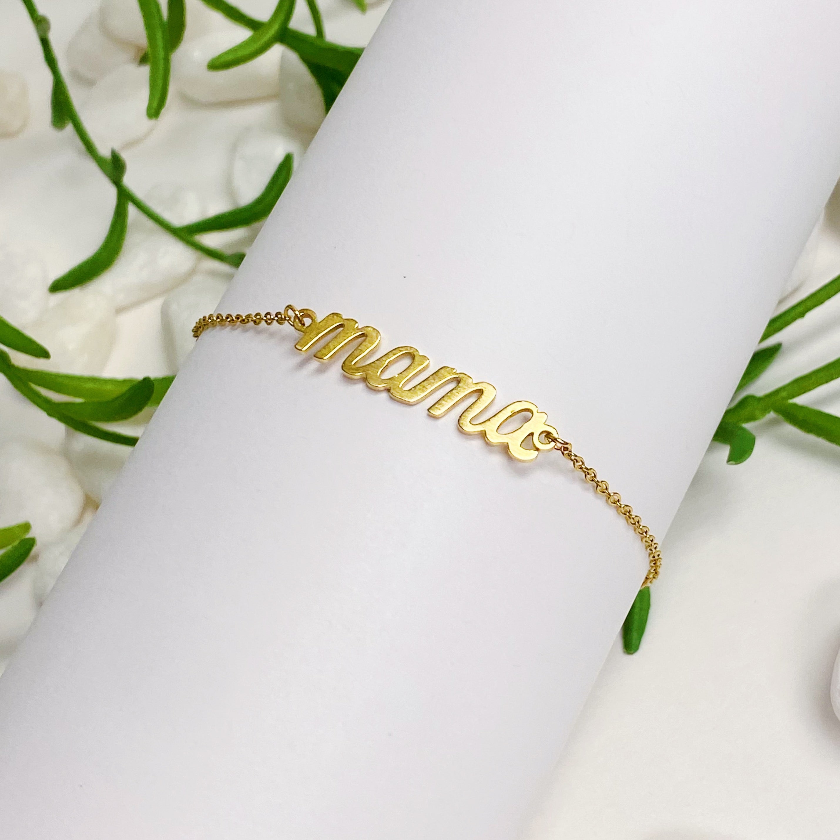 Mama Drawstring Bracelet featuring 'MAMA' in elegant font on a dainty sliding chain, made of 18k gold plated brass.