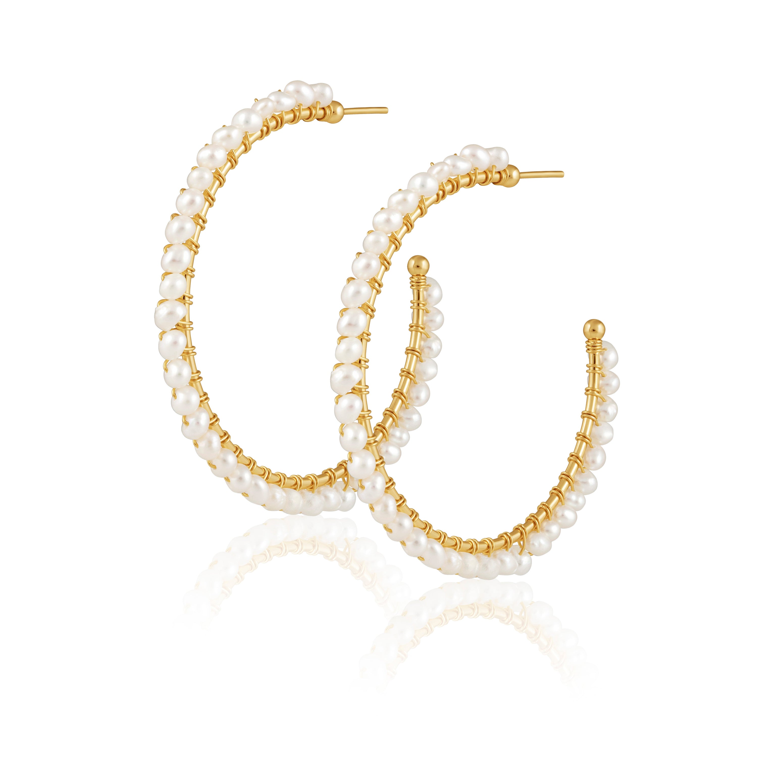 Elegant Marilyn Pearl Hoops featuring large hoop design and pearl detailing, perfect for enhancing any outfit.